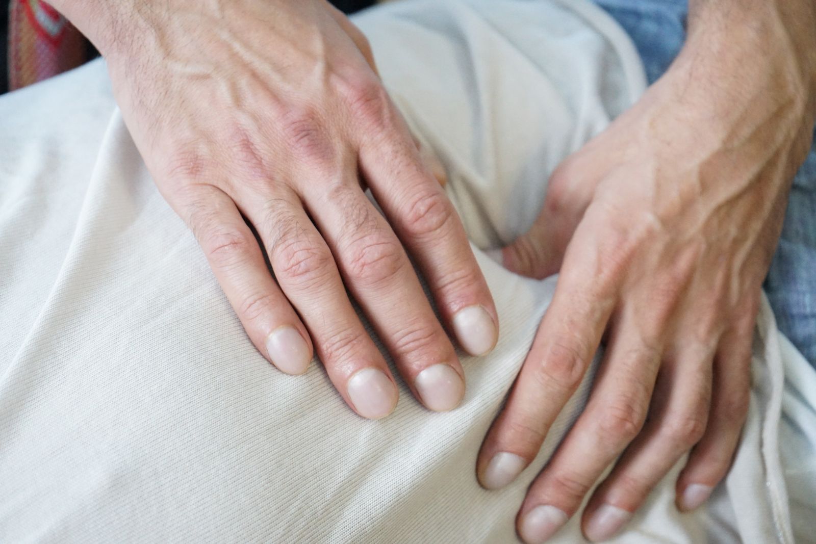 Close-up of hands giving a massage